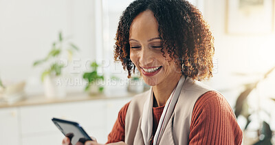Buy stock photo African woman, phone and texting in office with smile, good news or notification in startup. Happy, chat or entrepreneur reading message on mobile app, social media or networking at creative business