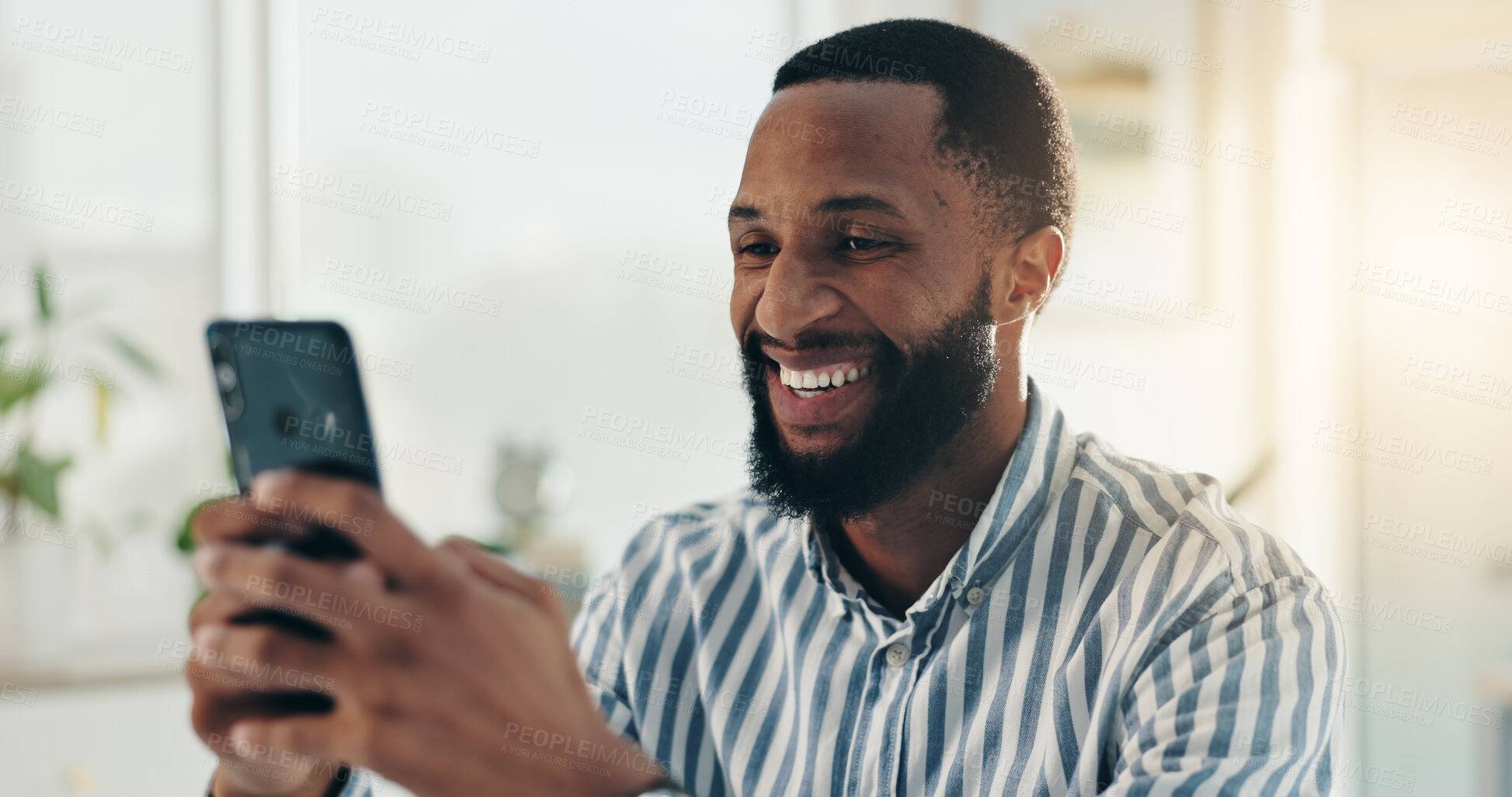 Buy stock photo Black man, phone and texting in office with smile, good news or notification in startup. Happy, chat and entrepreneur reading message on mobile app, social media or networking at creative business