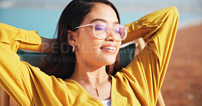 Buy stock photo Vacation, happy woman and relax at swimming pool for travel, holiday and tourist with sunglasses. Hotel, resort or girl outdoor to chill, rest or smile on comfortable chair for summer trip with peace