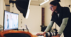 Woman, photographer and screen of computer in studio for production, editing image and retouch. Person, pc and review catalog to check picture, website selection and backstage for photoshoot results 
