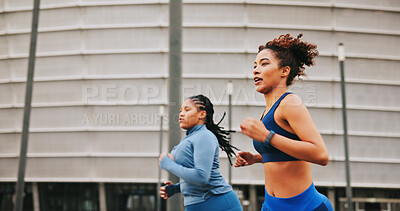 Buy stock photo Running, athlete and women on race, outdoor and practice for competition, speed or energy for sport. Fast, runner or training for marathon in city, African people and exercise for fitness or wellness