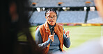 Interview, microphone and sports presenter in stadium for event streaming or live broadcast. News, television and question with journalist black woman at venue for media coverage of competition