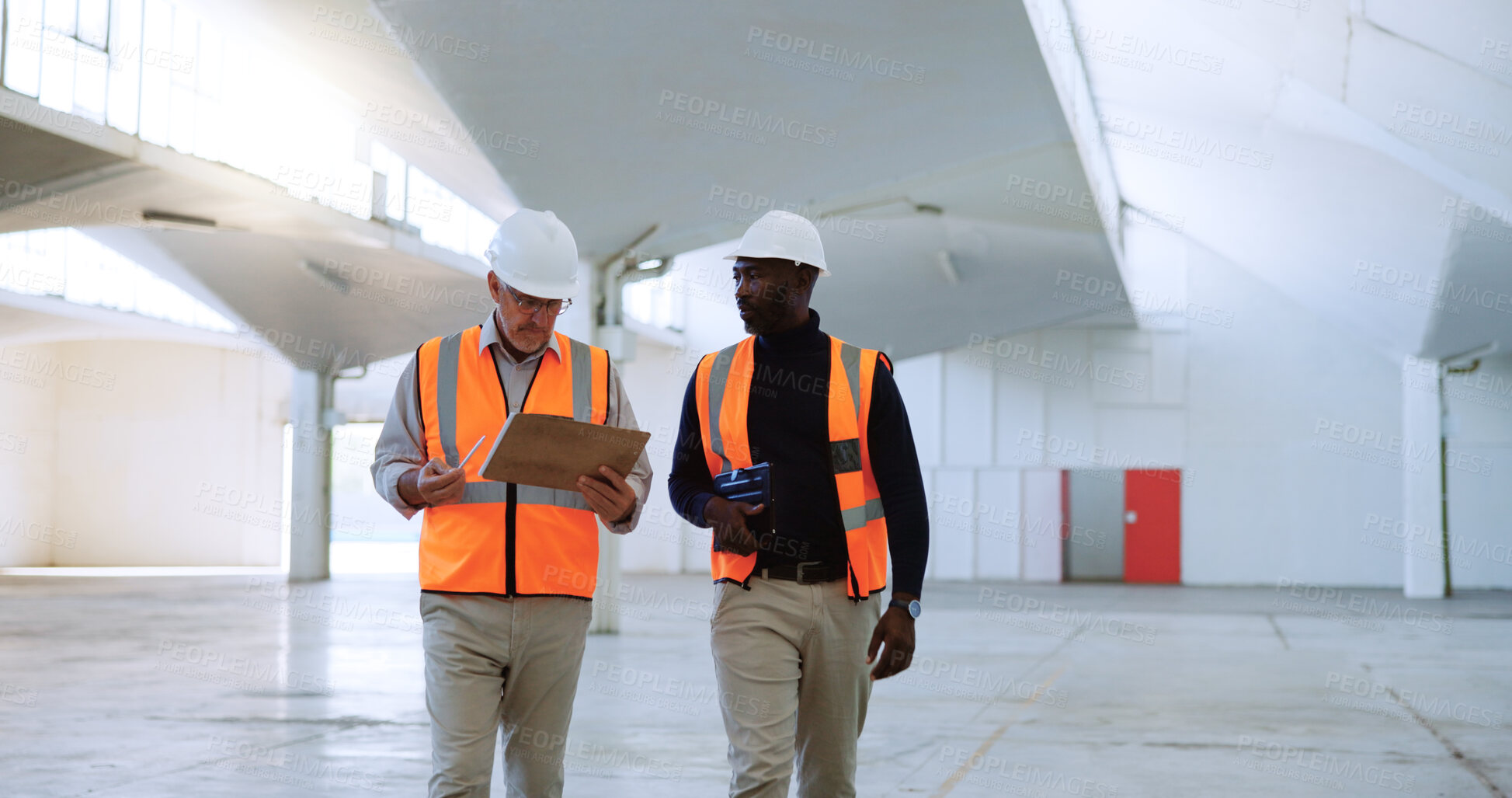 Buy stock photo Men, architect and talk with clipboard at warehouse, engineering or report for property development. People, mentor and building inspector with safety check, discussion or review at construction site