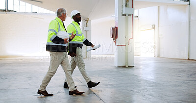Buy stock photo Men, discussion and construction worker at warehouse, inspection or review for safety check at plant. People, mature mentor and site management with architecture, talk and team at distribution center
