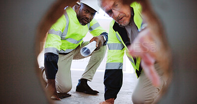 Buy stock photo Architecture, collaboration and pointing with construction worker people on building site together. Development, engineering and infrastructure with industrial team from hole POV for inspection