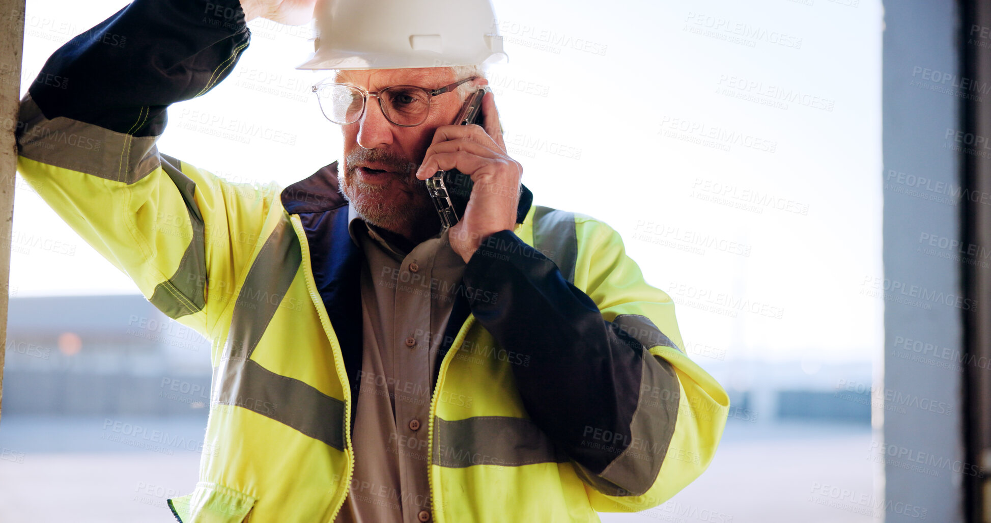 Buy stock photo Contractor, man and talking with phone call on site for building inspection, feedback or progress. Construction, mature person and speaking to contact for project management or renovation development