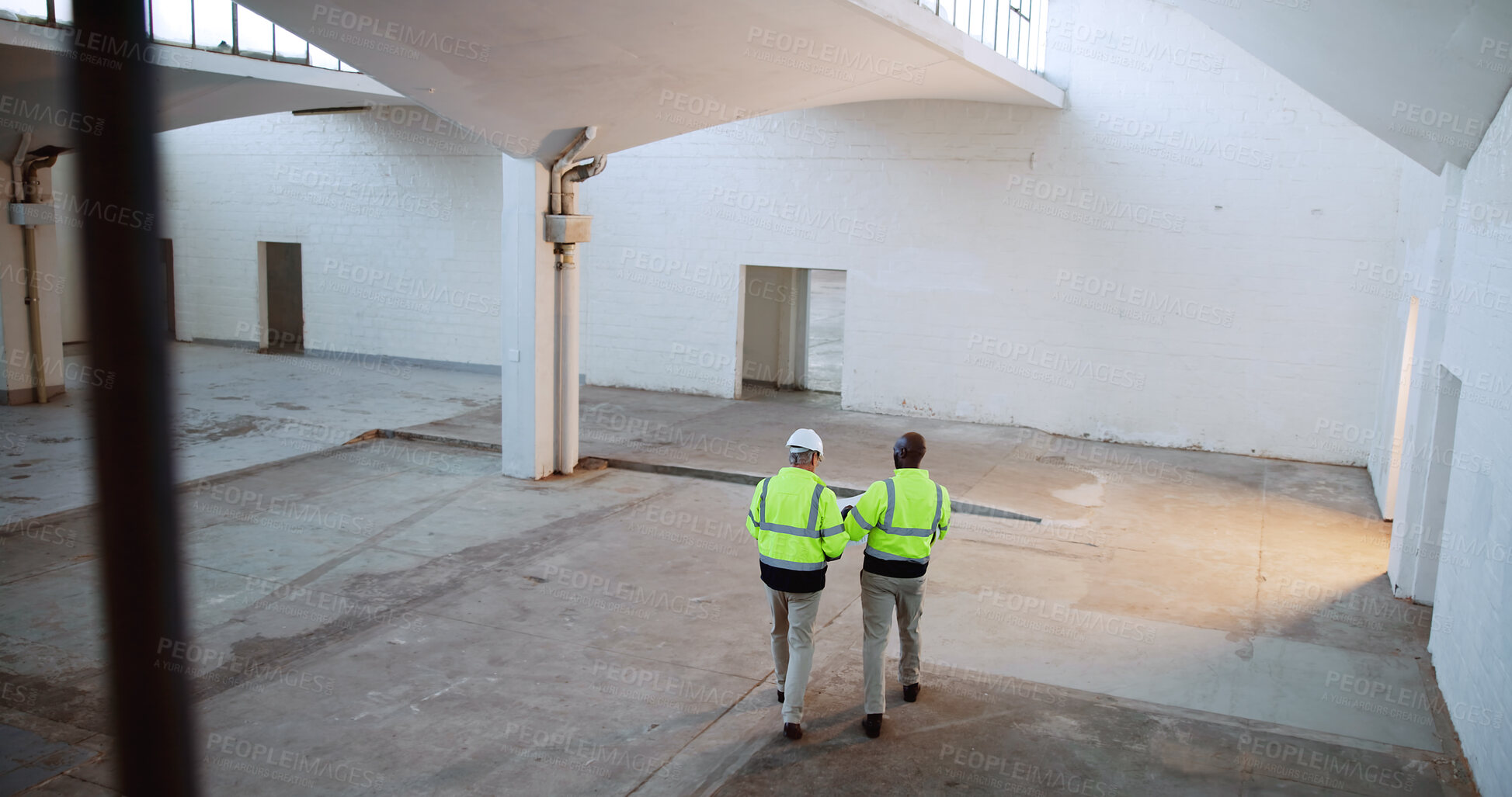 Buy stock photo Men, architect and back with blueprint, discussion and review for design with building inspection. People, technician and engineer with floor plan, paper and above with feedback at construction site