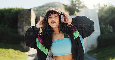 Buy stock photo Fashion, headphones and woman dance at park with energy, freedom and radio. Listening to music, smile and dancer outdoor for hip hop, streaming audio and sound for retro streetwear with portrait