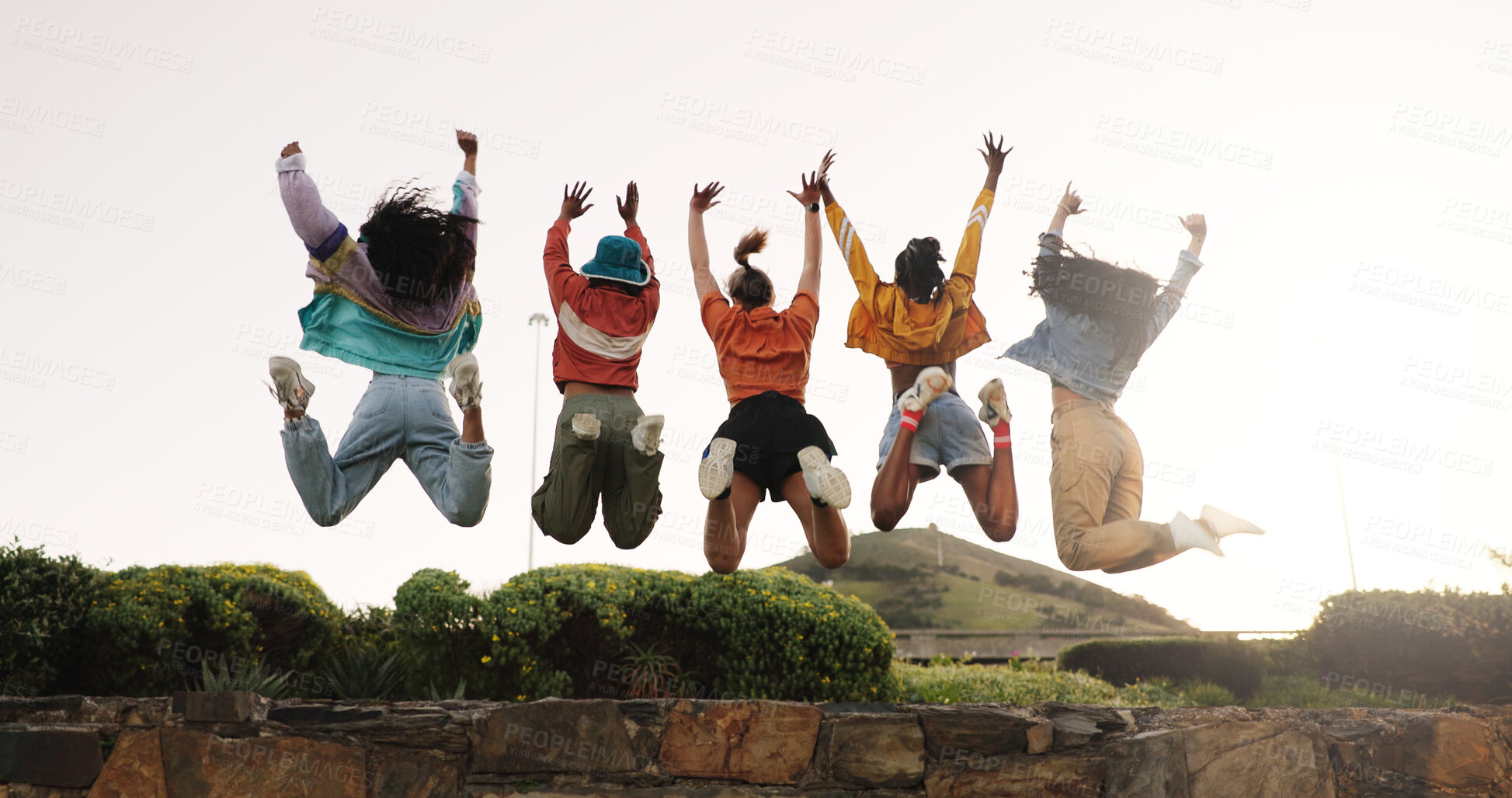 Buy stock photo Excited women, friends or fashion with jump in park for achievement, success or freedom together. Back view, female people or happy group in air for winning, excited or celebration in outdoor nature