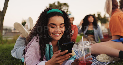Buy stock photo Communication, woman and smartphone on picnic, smile or texting with contact on social media or app. Friends, reunion and happy with chat on website, people and message with mobile, outdoor or typing