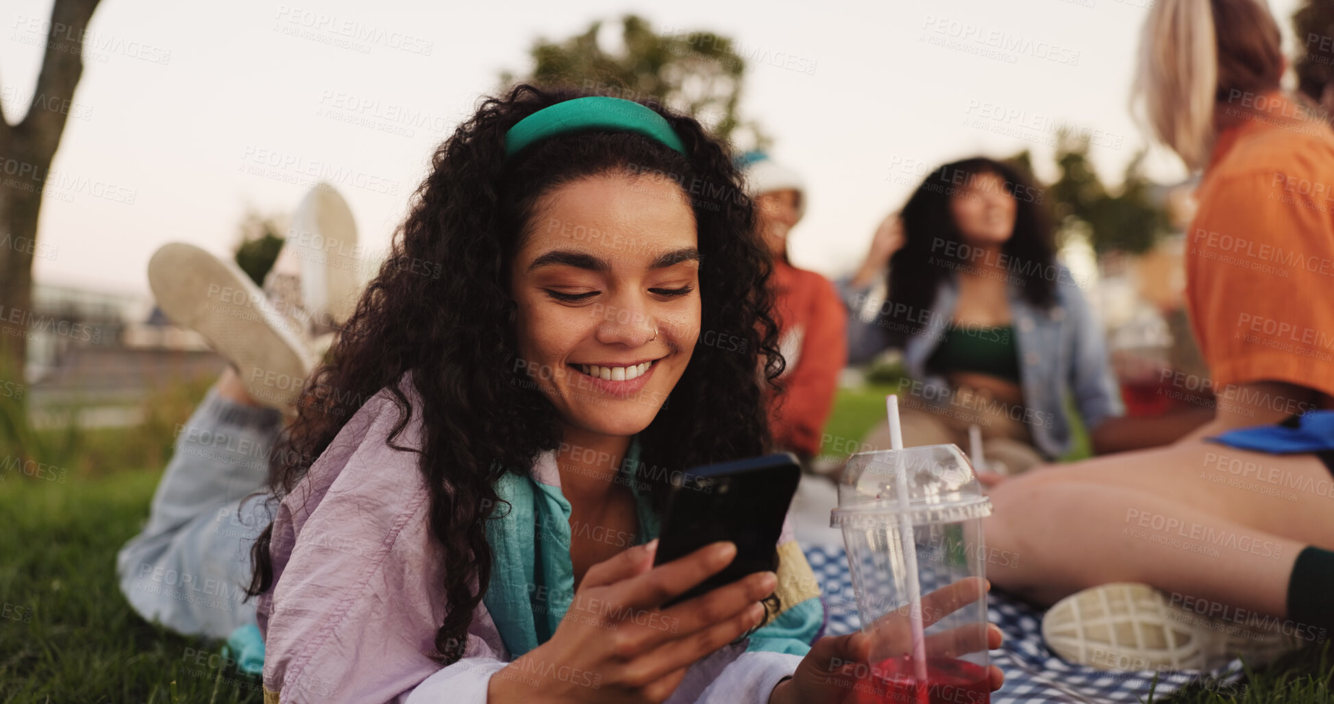 Buy stock photo Communication, woman and smartphone on picnic, smile or texting with contact on social media or app. Friends, reunion and happy with chat on website, people and message with mobile, outdoor or typing