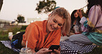 Texting, woman and smartphone on picnic, chilling and communication with contact on website and app. Friends, reunion and happy with chat on social media, people and message with mobile or outdoor