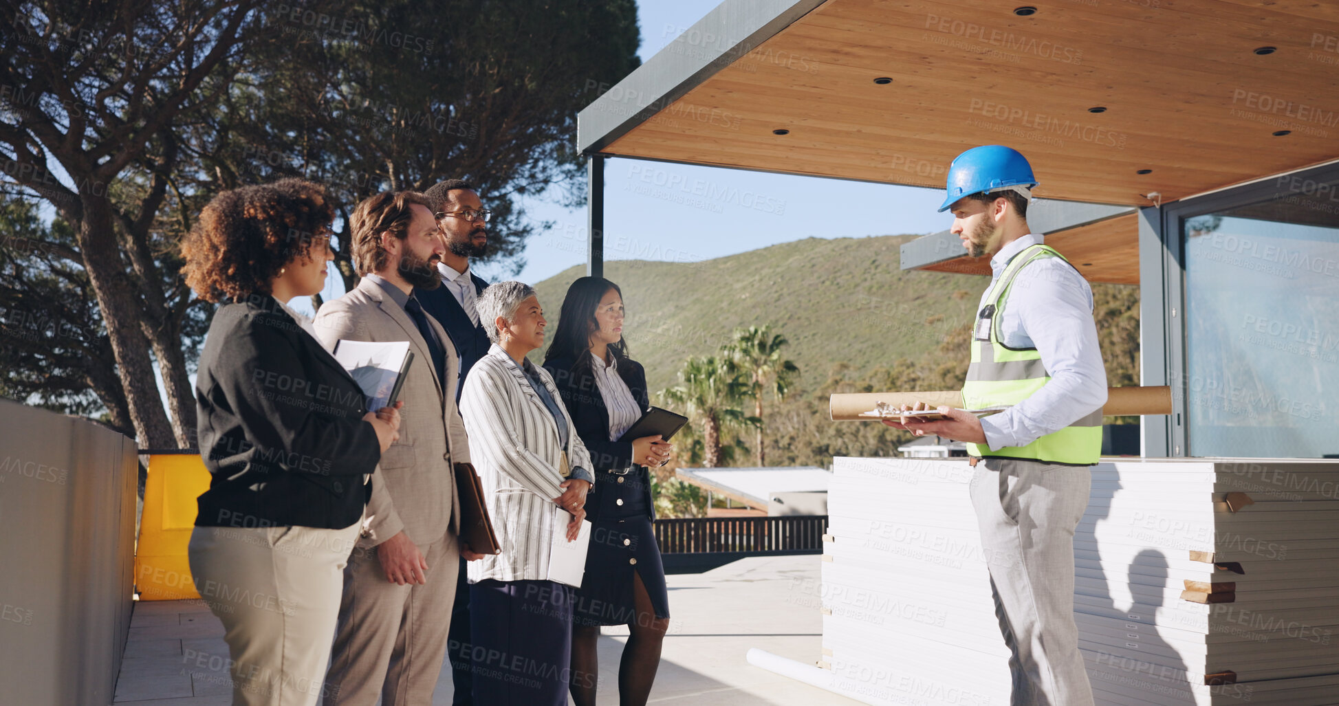 Buy stock photo Architect, business people and meeting at construction site, talk and investor group in property development. Man, engineer and contractor in discussion, presentation and planning for real estate