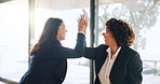 Business women, high five and happy at office with success, goals and achievement at legal agency. Lawyer, team and partner with celebration, thanks and promotion by window at corporate law firm