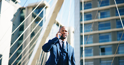 Buy stock photo Phone call, thinking and walking with business black man outdoor in city for networking or travel. Buildings, communication and planning with corporate employee on bridge downtown for commute