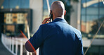 Back, phone call and walking with business man outdoor in city for commute, networking or travel. Communication, contact and schedule with corporate employee on bridge downtown for mobile update