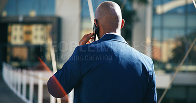 Buy stock photo Back, phone call and walking with business man outdoor in city for commute, networking or travel. Communication, contact and schedule with corporate employee on bridge downtown for mobile update