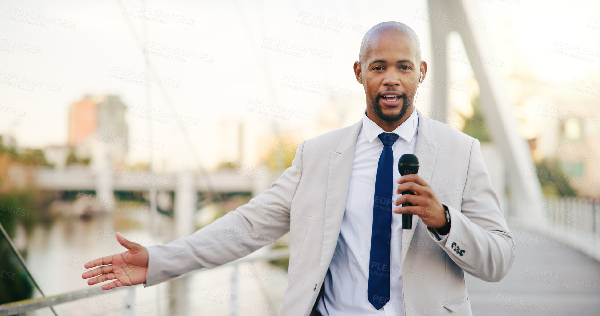 Buy stock photo Microphone, news and portrait of black man in city for live television broadcast as presenter. Journalism, story and streaming with reporter outdoor on bridge in urban town for information or update