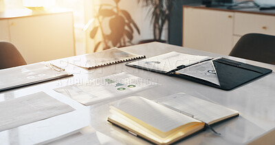 Desk, notebook and finance documents in office for meeting with profit, statistics or investment. Research, paperwork and table in empty workplace for company budget planning, forecasting or charts.