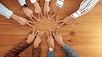 Business people, hands and top view of star with support, collaboration or team building. Above, group or employees with fingers on wooden table in office for synergy, meeting or solidarity together