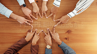 Buy stock photo Business people, hands and top view of star with support, collaboration or team building. Above, group or employees with fingers on wooden table in office for synergy, meeting or solidarity together