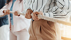 Hands, business and people with rope in office for tug of war, competition and corporate challenge. Staff, pulling and equipment for collaboration, contest and employees battle for power in workplace