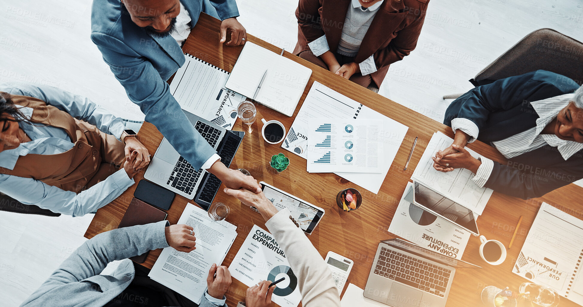 Buy stock photo Deal, people and handshake with client, paperwork and gesture for agreement in boardroom or meeting. Colleagues, collaboration or shaking hands for opportunity in office, above and success of merger