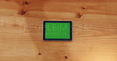 Buy stock photo Above, tablet and green screen on table with connection, internet and website display. Technology, mockup space and online in business for connectivity, platform UI and UX for digital marketing