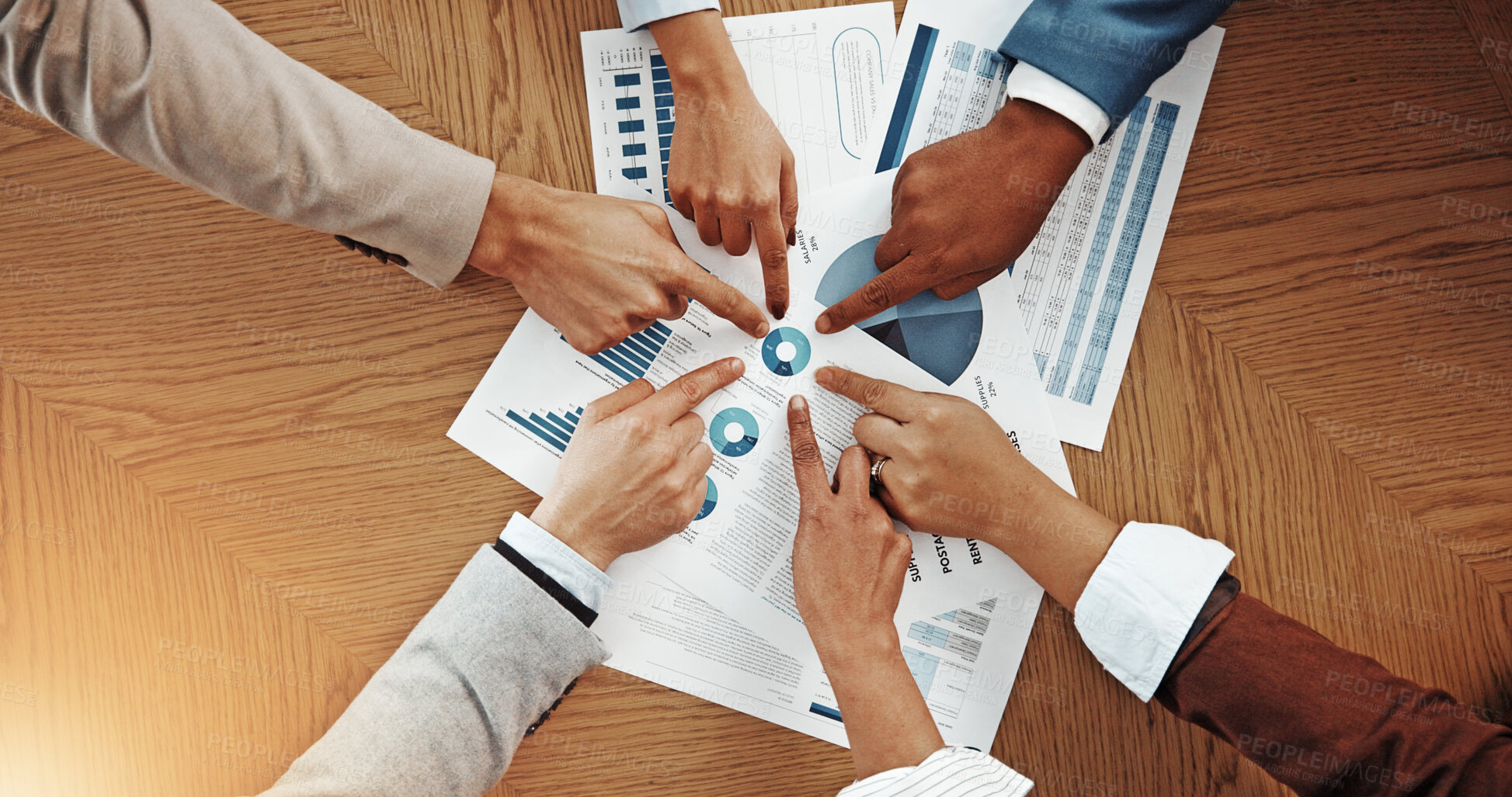 Buy stock photo Business people, hands and pointing with documents above for corporate mission or target in office. Top view, group or employees with paperwork, statistics or analytics for performance in workplace