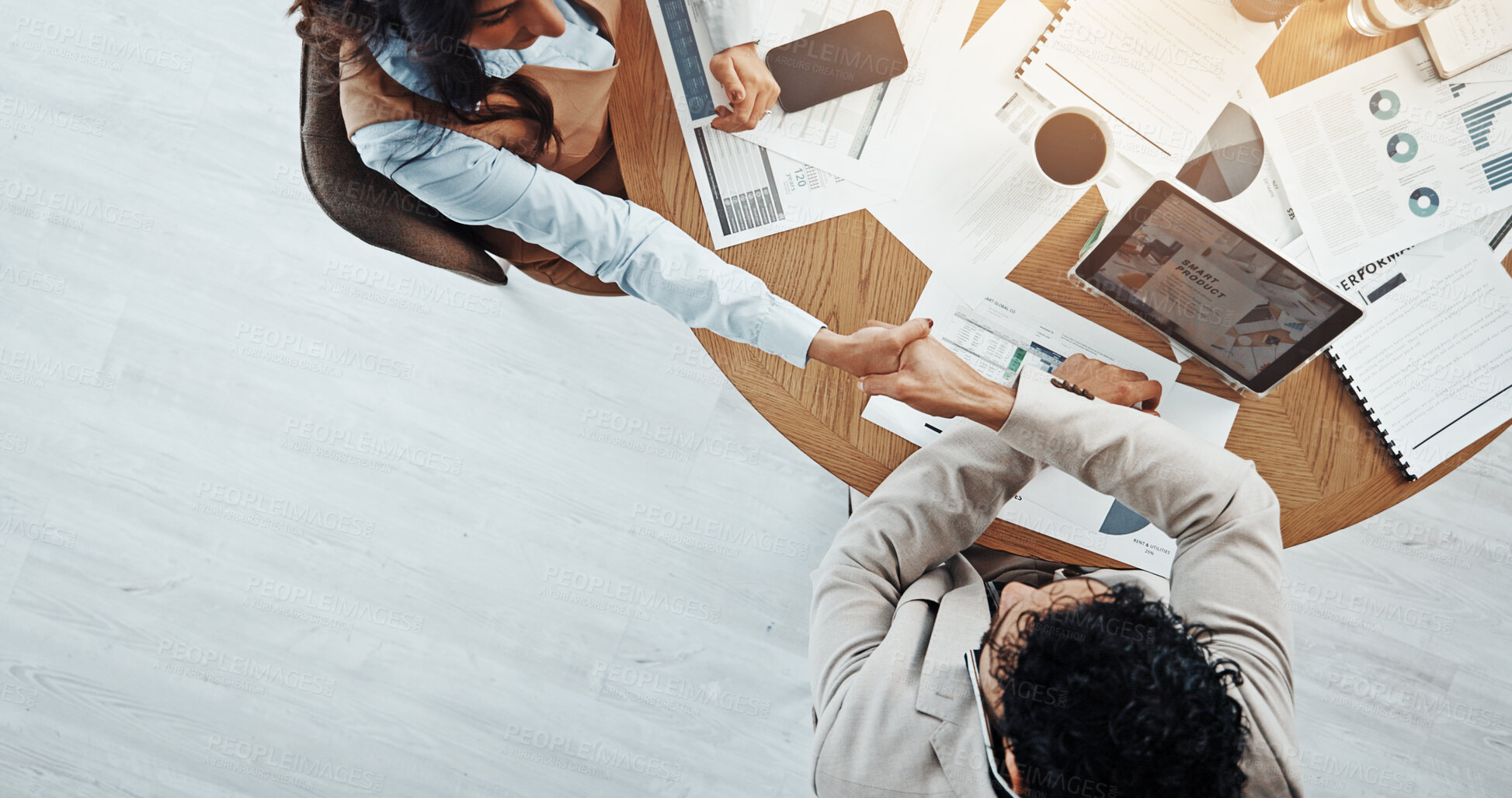 Buy stock photo Meeting, people and handshake with client, paperwork and gesture for agreement in boardroom or deal. Colleagues, collaboration or shaking hands for opportunity in office, above and success of merger