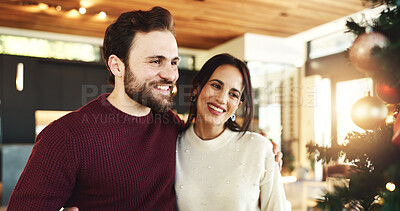 Buy stock photo Christmas, couple and smile for decoration, home and romance in festive season, tree or celebration. Happy, man and bonding with woman on holiday, December or love on weekend in house or relationship