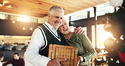 Buy stock photo Senior, couple or hug in home for Christmas, love or romance in festive season or embrace. Smile, marriage and happy elderly people bonding in lounge for holiday, relationship and support in house