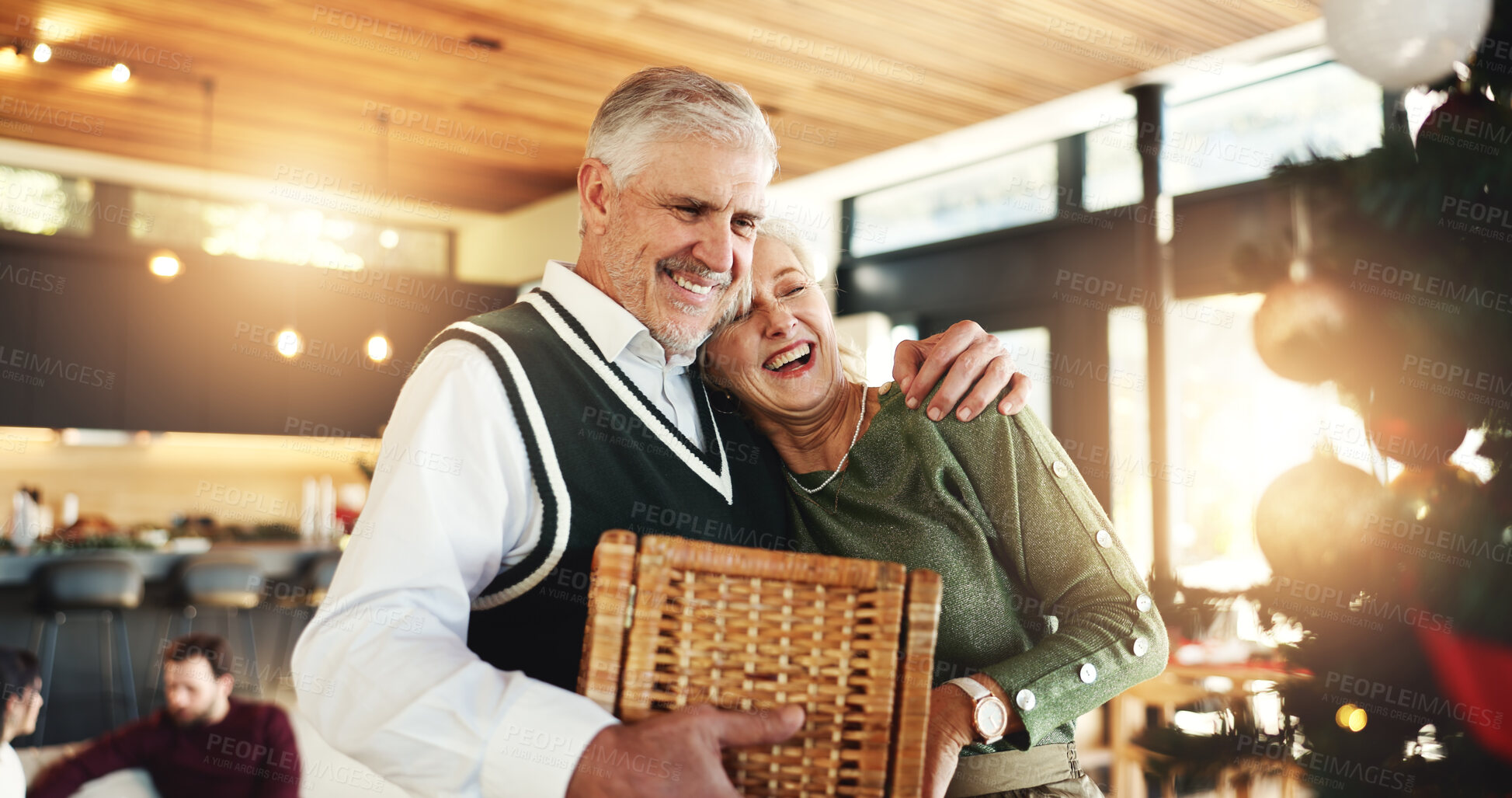 Buy stock photo Senior, couple or hug in home for Christmas, love or romance in festive season or embrace. Smile, marriage and happy elderly people bonding in lounge for holiday, relationship and support in house