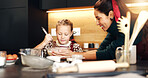 Mom, girl and bowl with whisk at Christmas with smile, teaching and ingredients for cookies in home. People, mother and daughter in kitchen, learning and guide for baking at xmas in family house