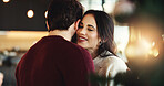 Dancing, couple and celebration for Christmas, smile or romance in festive season, embrace and home. Happy, woman and bonding with man on holiday, December or love on weekend in house or relationship