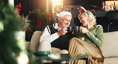 Buy stock photo Senior, happy couple or coffee with toast for Christmas, love or romance in festive season in home. Smile, marriage support and elderly people bonding on sofa in lounge for holiday, cheers and tea