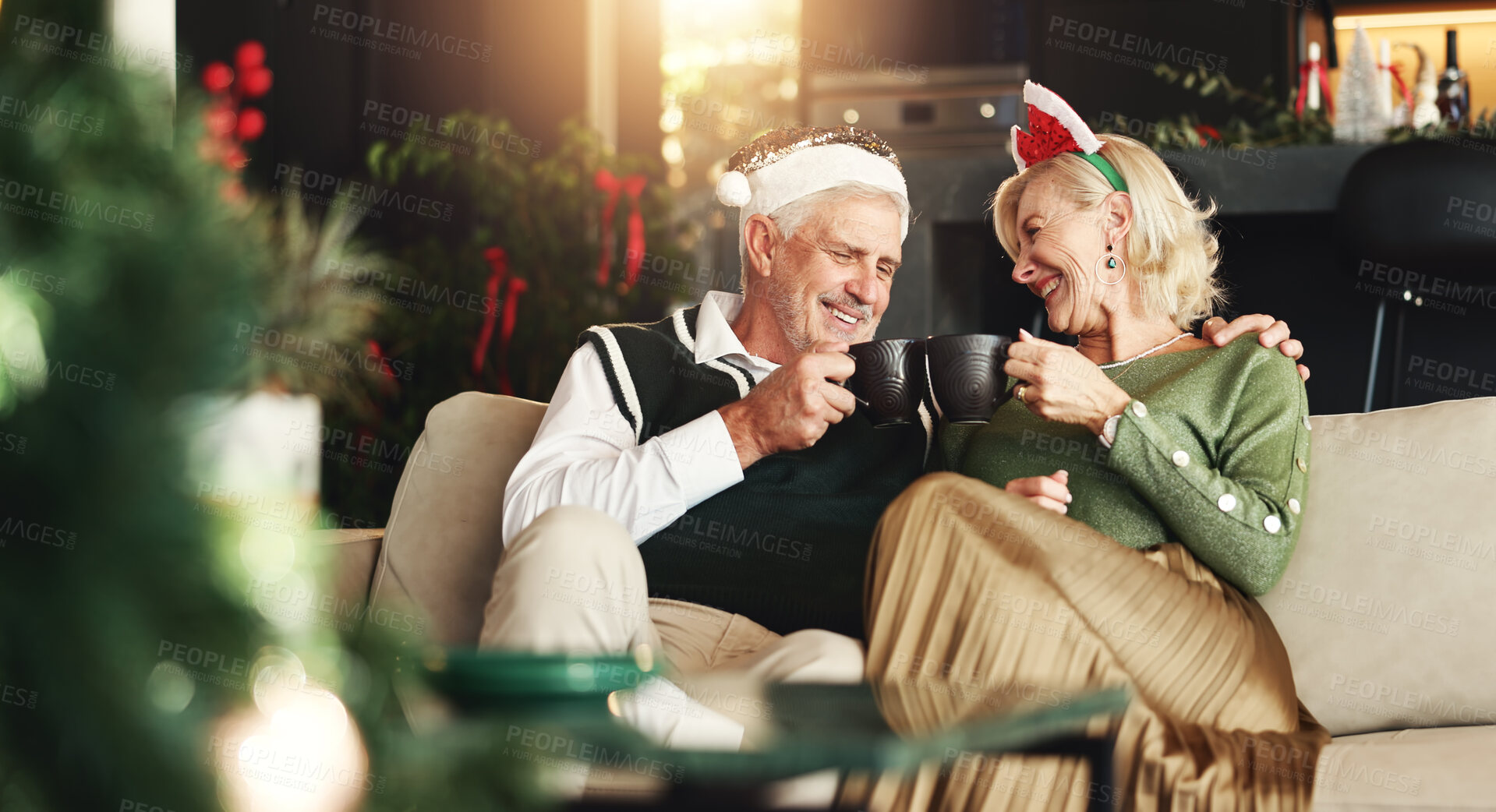 Buy stock photo Senior, happy couple or coffee with toast for Christmas, love or romance in festive season in home. Smile, marriage support and elderly people bonding on sofa in lounge for holiday, cheers and tea