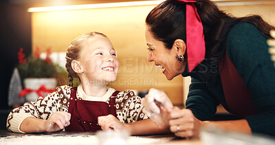 Buy stock photo Christmas, baking and mother having fun with daughter in kitchen for December holiday season. Bonding, love and smile of girl child with happy single parent in home for festive celebration or cooking