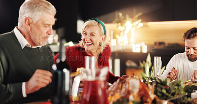 Buy stock photo Christmas, dinner and family with laugh in home for bonding, festive celebration or social gathering. Happy people, food or conversation together in house with love, holiday reunion and relationship