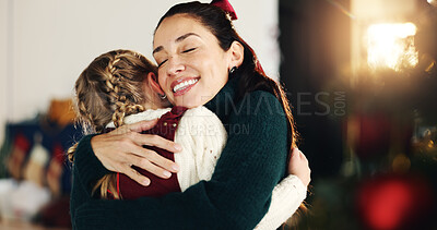 Buy stock photo Christmas, hug and smile of mother with daughter in living room of home for celebration together. December, festive or winter with happy single parent and girl child embracing in apartment for love