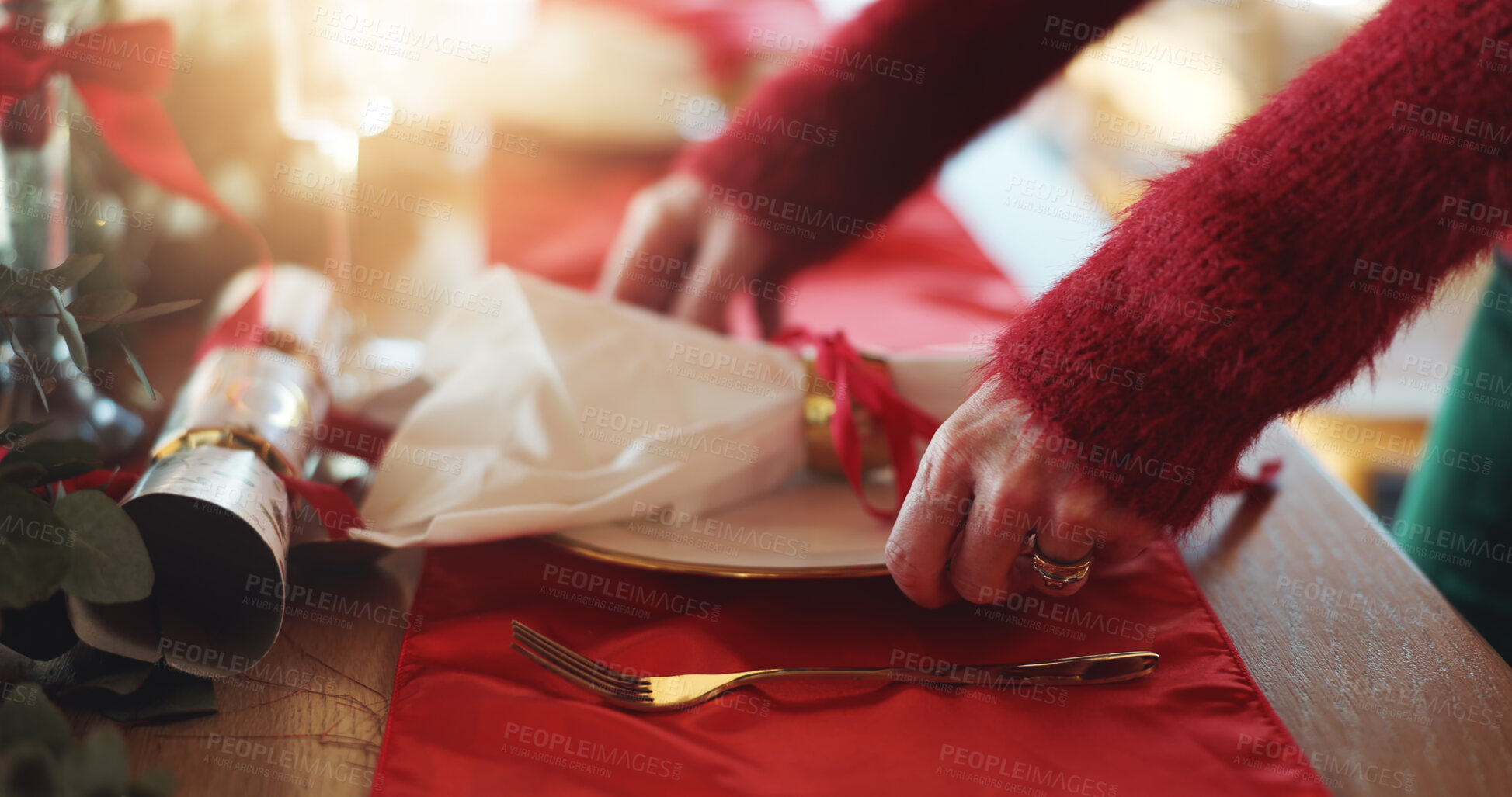 Buy stock photo Christmas, hands and plate with person in dining room, getting ready for celebration or lunch. Festive, place setting and table with hostess in apartment for December or social gathering closeup