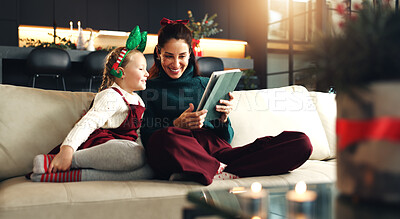 Buy stock photo Christmas, happy mother and child with tablet in home for holiday movie, game and watch cartoon. Xmas, parent and kid with tech in living room for festive show, learning and family bonding together