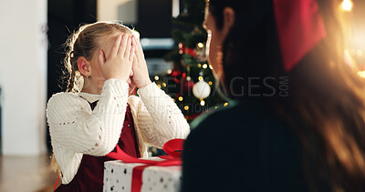 Buy stock photo Girl, mom and cover eyes for Christmas present, tree and surprise with love, bonding and festive holiday. Child, mother and daughter with box, package and gift with xmas celebration at family house