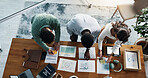 Paperwork, technology and business people in office with planning for investment growth with teamwork. Documents discussion and financial advisors with statistics for profit report from above.