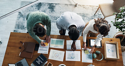 Buy stock photo Paperwork, technology and business people in office with planning for investment growth with teamwork. Documents discussion and financial advisors with statistics for profit report from above.