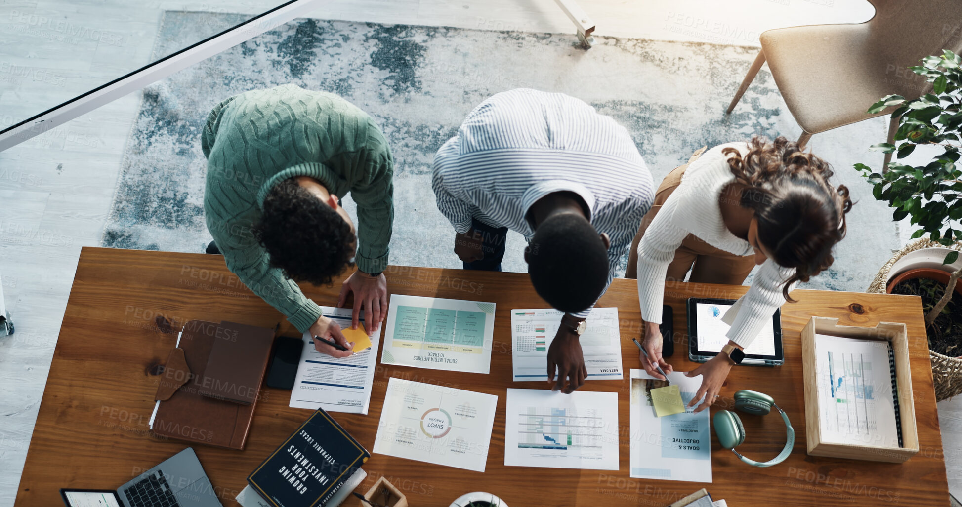 Buy stock photo Paperwork, technology and business people in office with planning for investment growth with teamwork. Documents discussion and financial advisors with statistics for profit report from above.