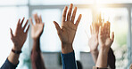 Hands raised, question and group of business people in meeting as audience for volunteering or answer. Gesture, team and vote in office with idea, engagement and feedback of employees at workplace