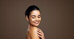 Thinking, woman and happy with bodycare, glow and cosmetics for smooth skin, shine and mockup space. Studio background, reflection and person with smile for skincare, dermatology and facial treatment