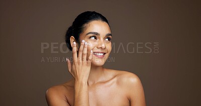 Buy stock photo Thinking, woman and happy with cream, skincare or cosmetics for smooth skin, shine and mockup space. Studio background, reflection and person with smile for beauty, dermatology and facial treatment