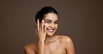 Beauty, portrait and woman with face cream in studio for collagen treatment, hydration and routine. Mockup, person and happy with moisturizer application on brown background for skin glow and retinol